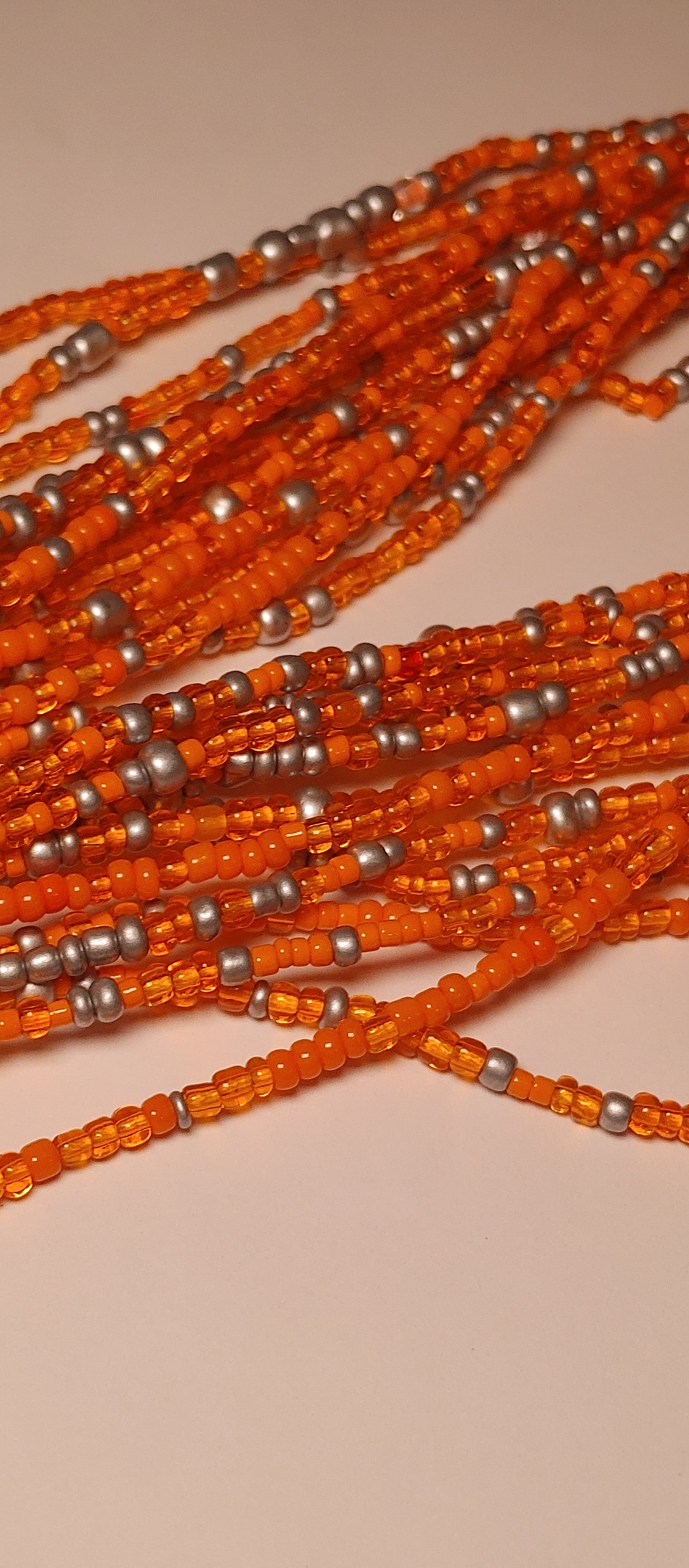 Orange orbit waistbeads