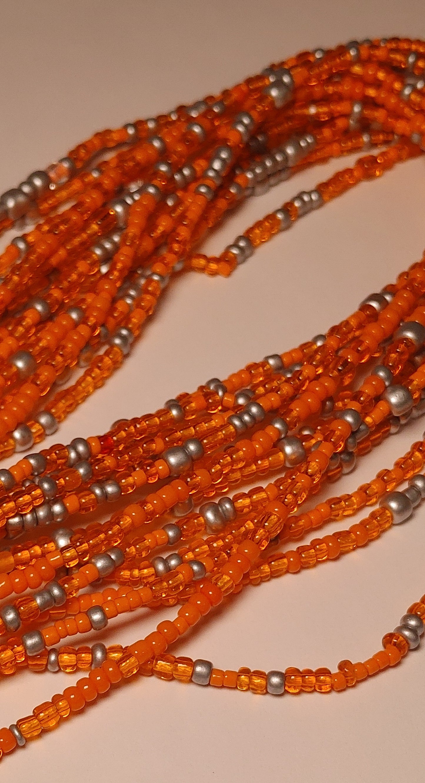 Orange orbit waistbeads