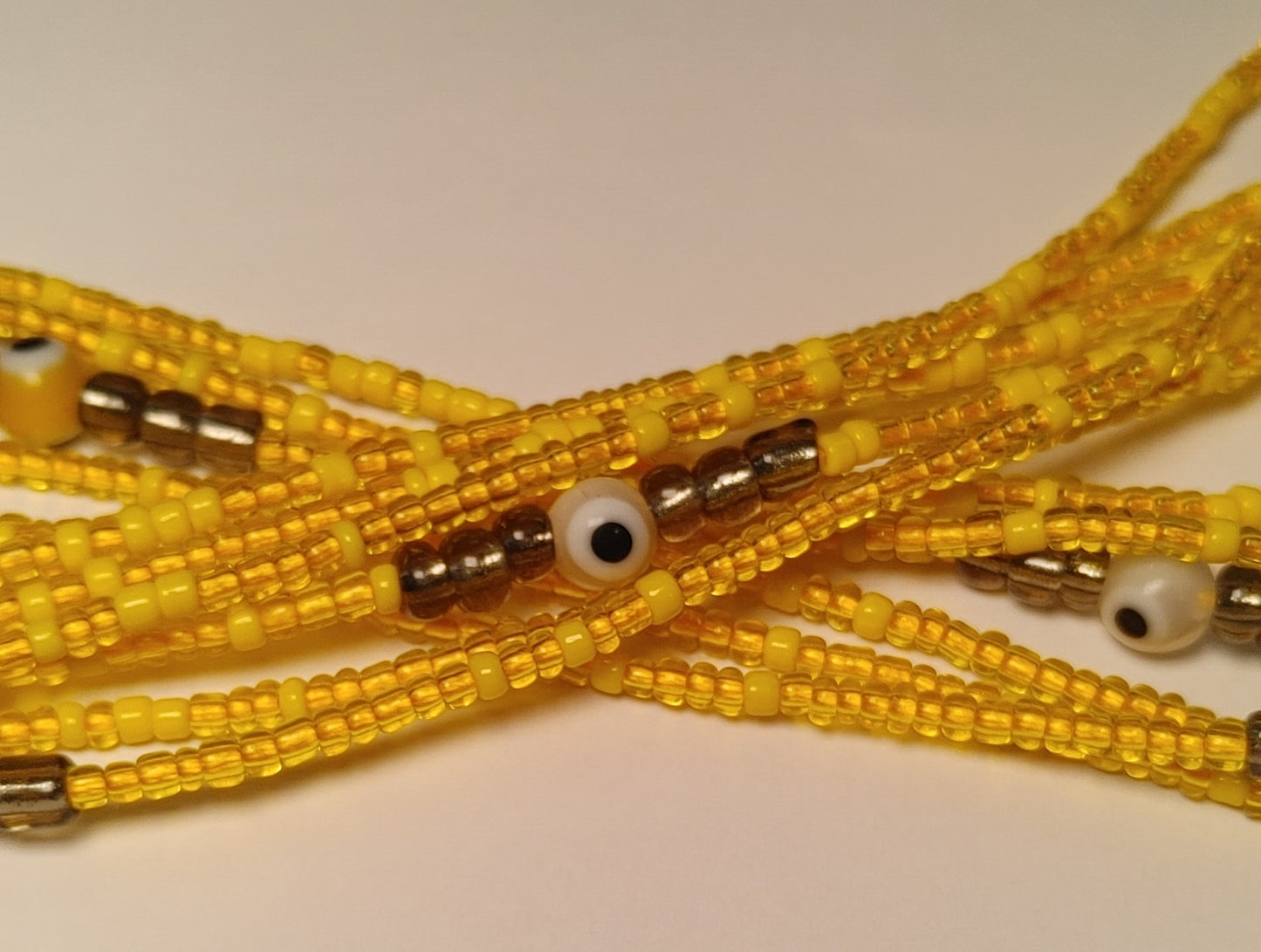 Yellow evil waistbeads