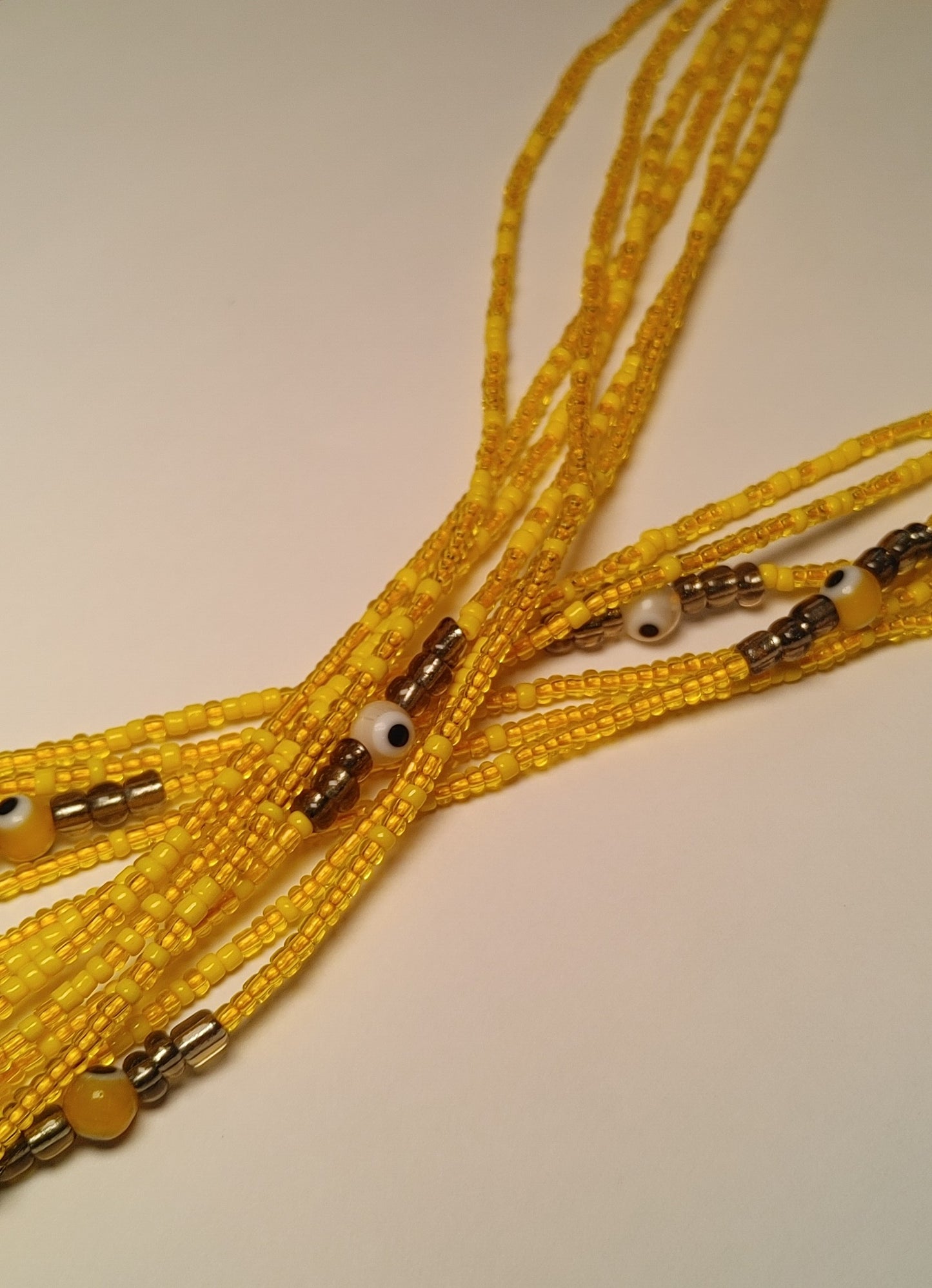 Yellow evil waistbeads