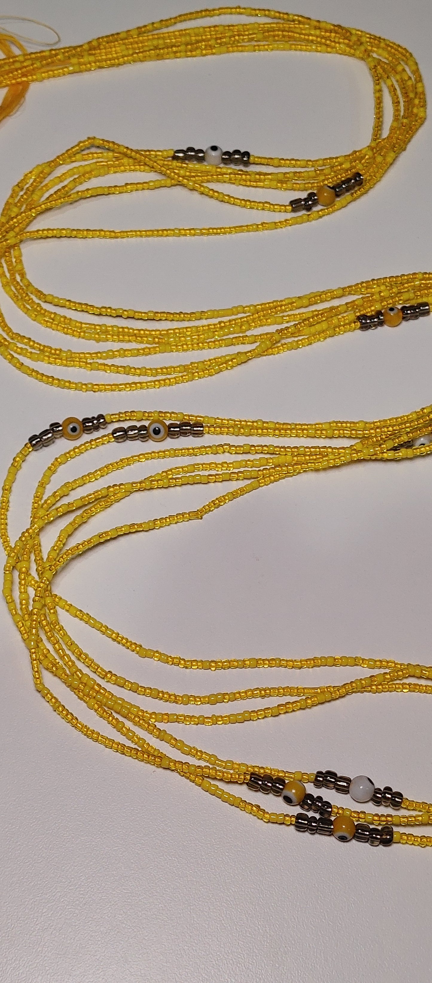 Yellow evil eye waistbeads