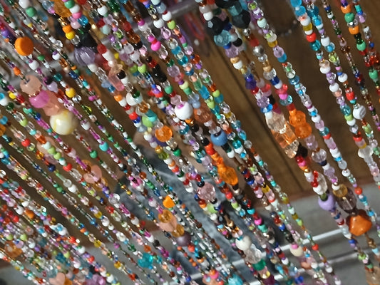 Glow in the dark custom orange confetti bead curtains