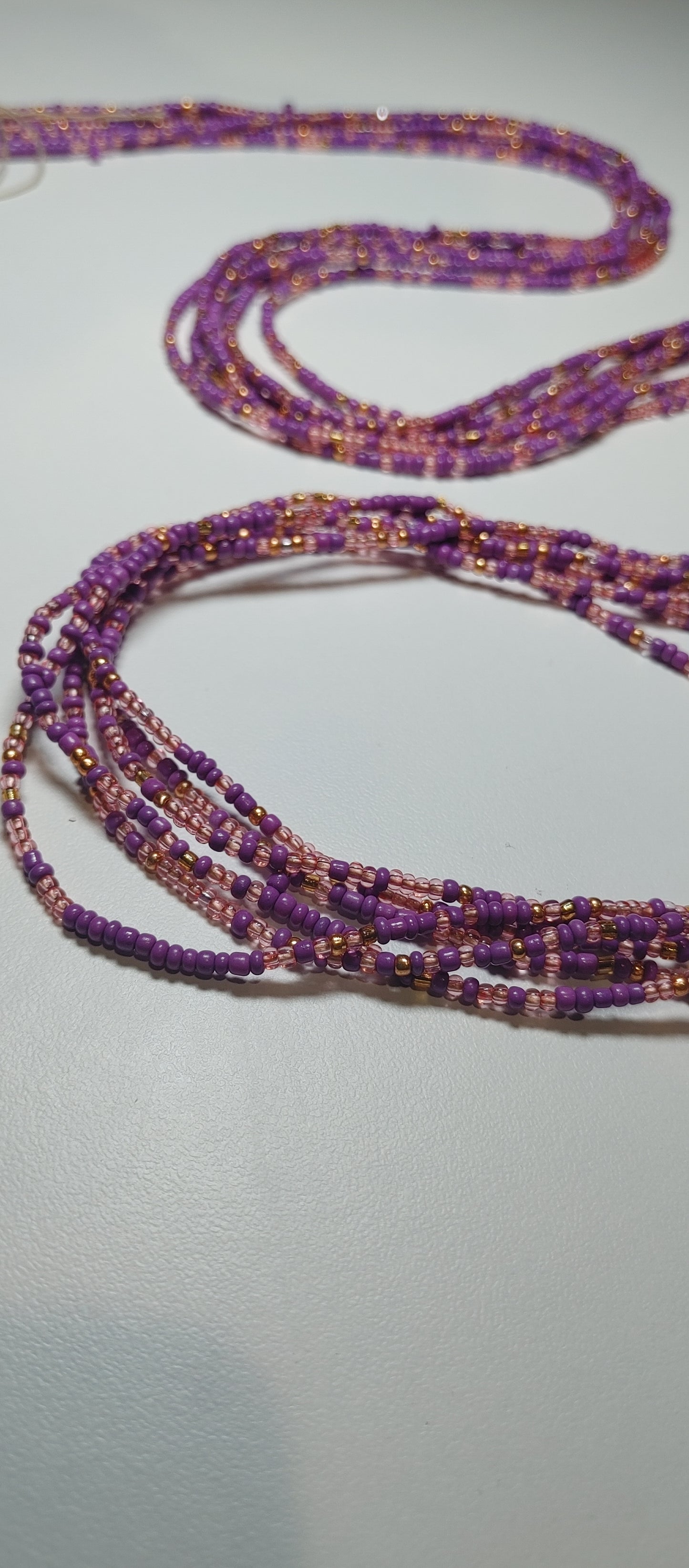 Purple and gold waistbeads.